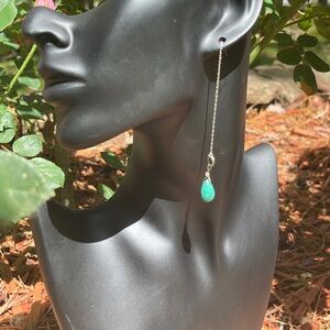 Dangle pierced earrings featuring turquoise and sterling silver chains